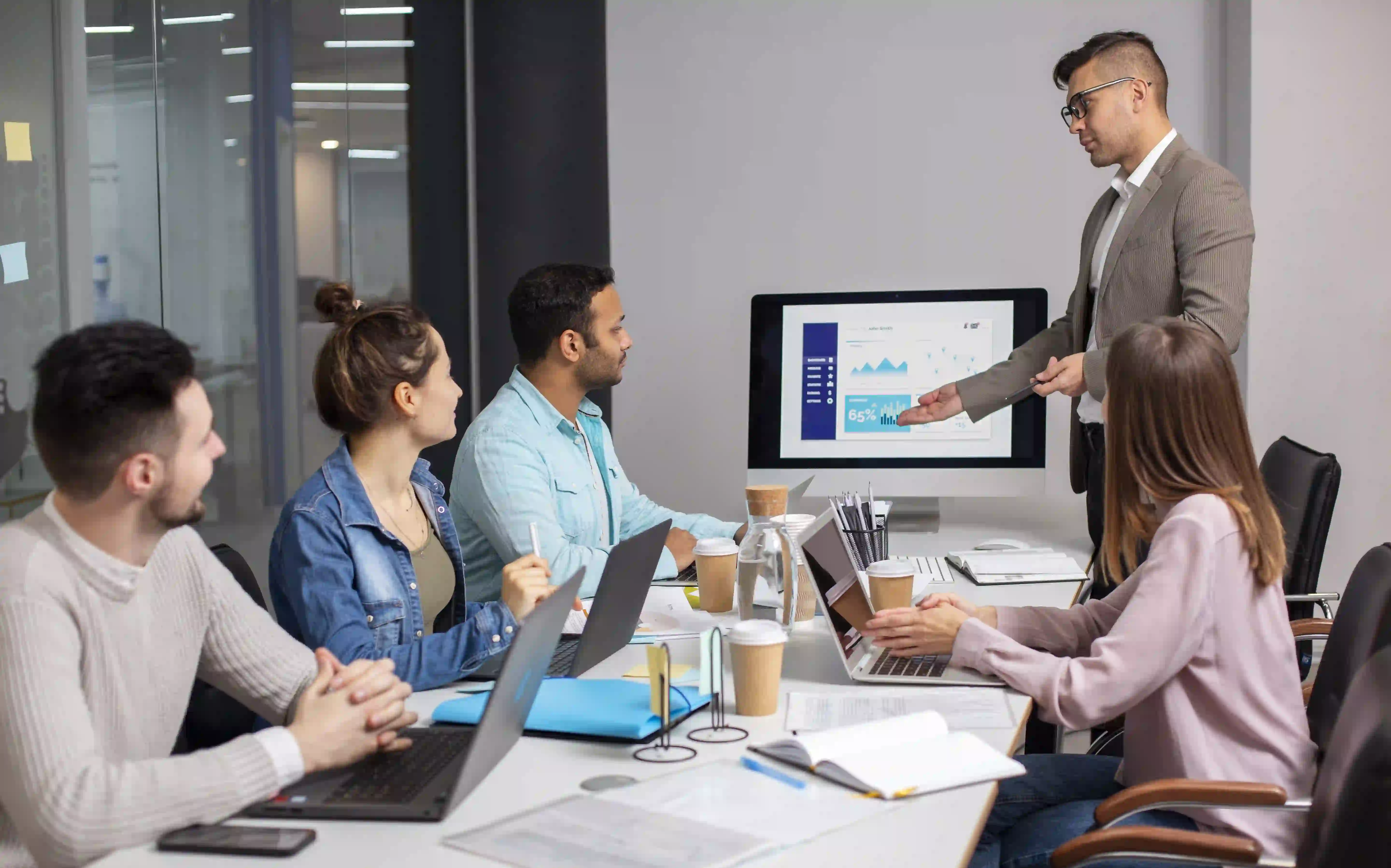 Indian marketing agency team strategizing in a modern office for end-to-end brand growth solutions